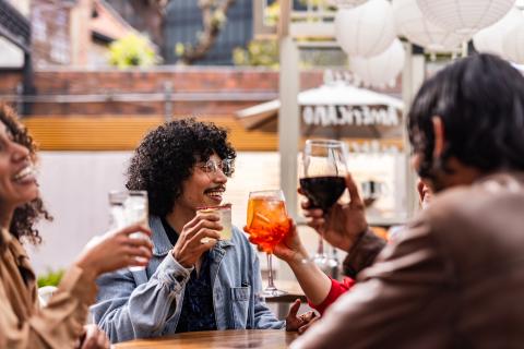 a group of people enjoying cocktails and wine